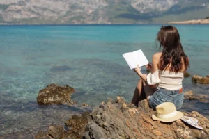 a girl sitting on the rock