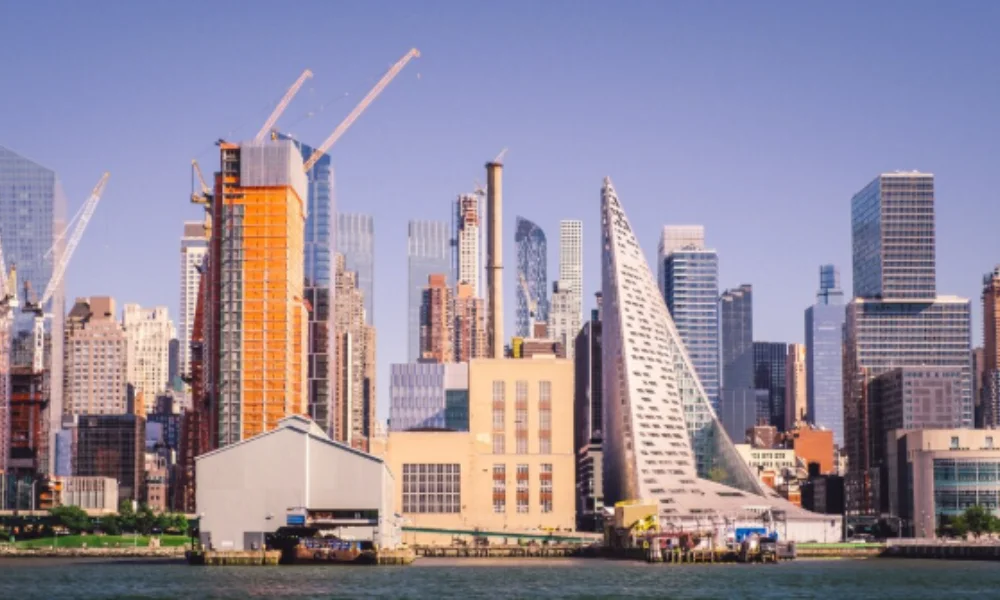Skyline featuring modern skyscrapers with unique architecture along a waterfront