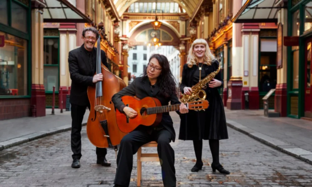 A trio of musicians performs in a covered market-places to visit in nashville