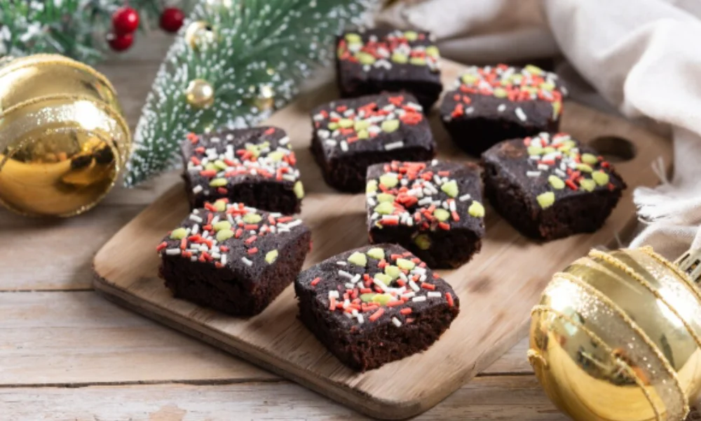 Festive brownies topped with colorful sprinkles on a wooden board-easy fudge recipes