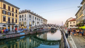 A picturesque canal scene in Milan's Navigli district at sunset