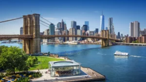 A sunny view of the Brooklyn Bridge over the East River