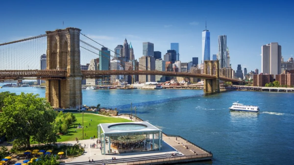 A sunny view of the Brooklyn Bridge over the East River