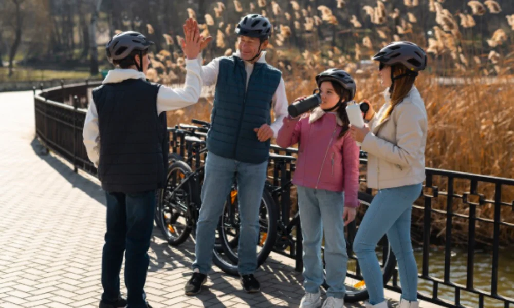 A family of four in helmets enjoys a sunny day in a park-things to do in washington state