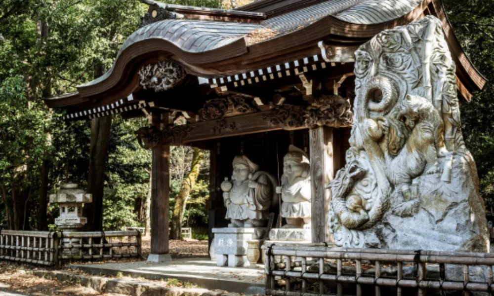 A traditional Japanese shrine with intricate woodwork roof