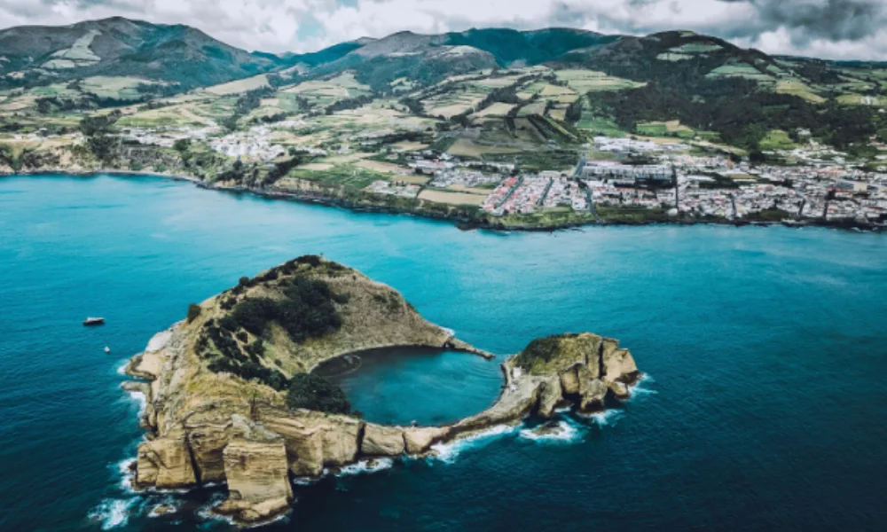 Aerial view of a rocky island with a small lagoon