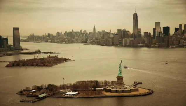 Statue of Liberty rising above the water-new york city attractions map