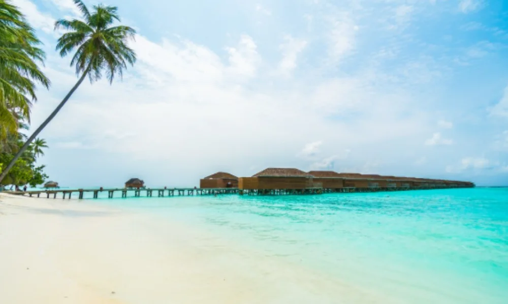 A tranquil beach scene with clear turquoise water-tropical places to visit