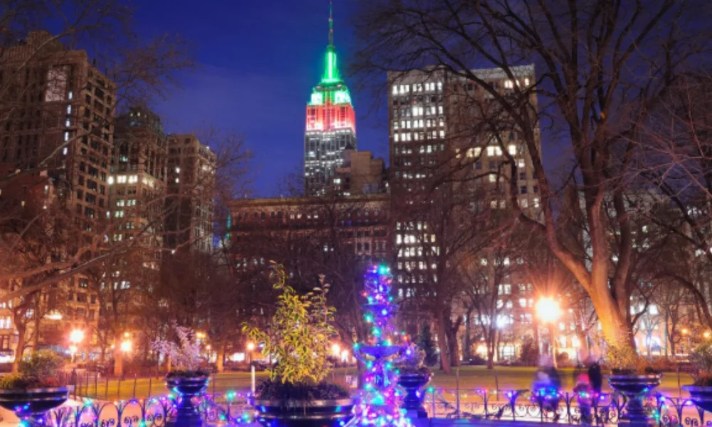 A nighttime city scene featuring a brightly lit building with green and red lights-places to visit during christmas