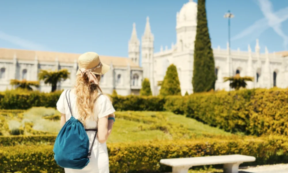 A woman with long hair, wearing a summer hat-places to visit in portugal