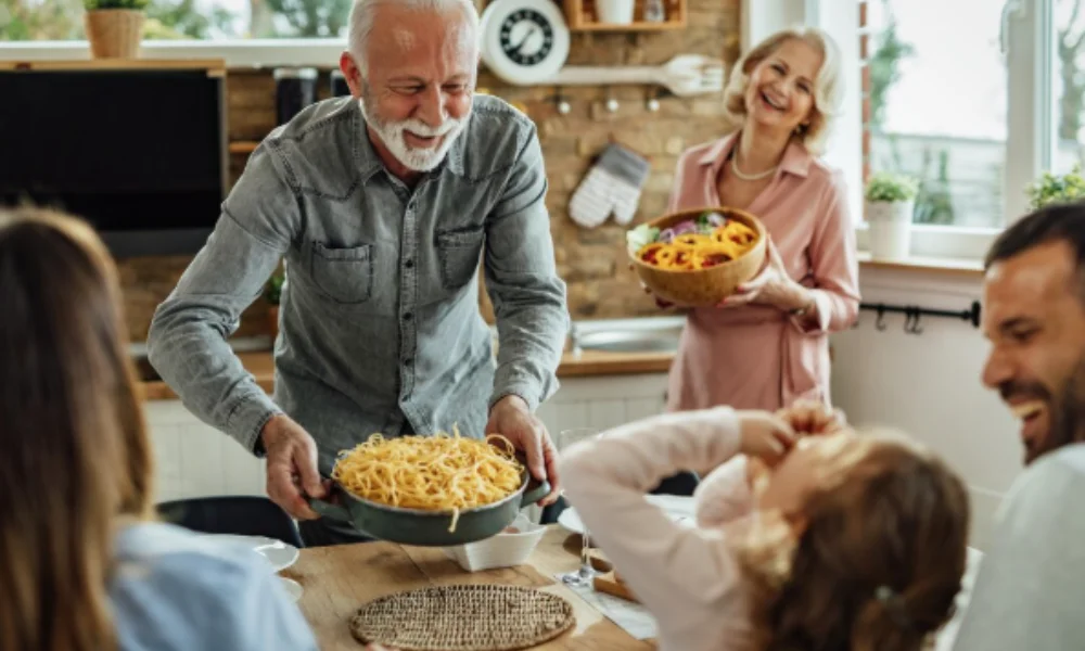 Cheerful family gathering in a cozy kitchen-easy chicken spaghetti recipe