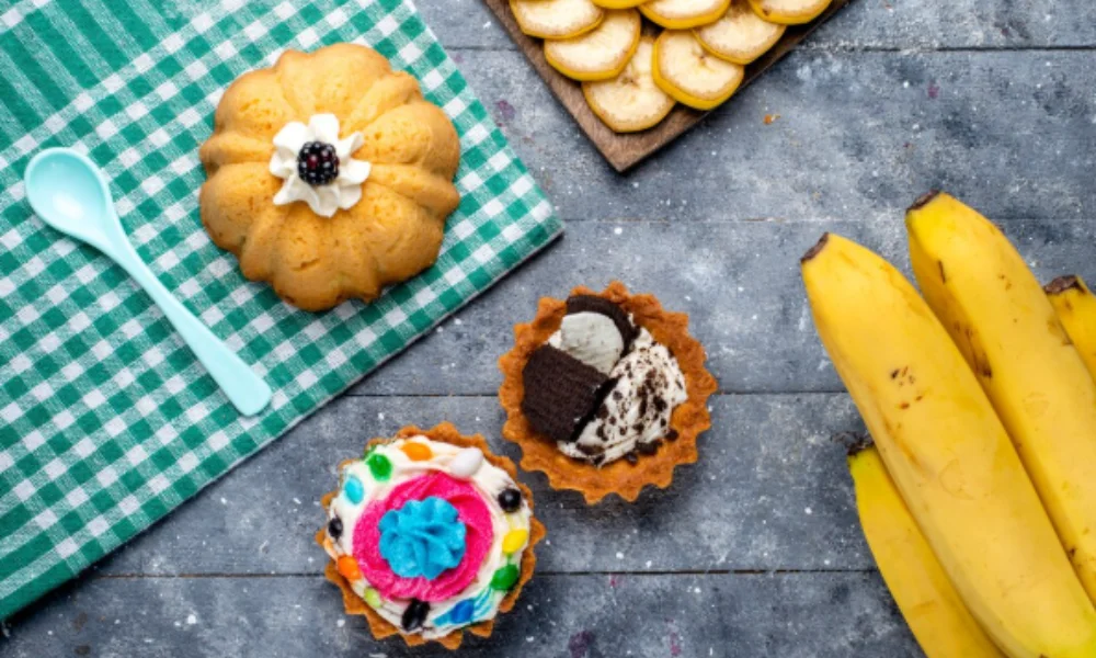 Assorted desserts on a textured gray table-easy banana muffin recipe
