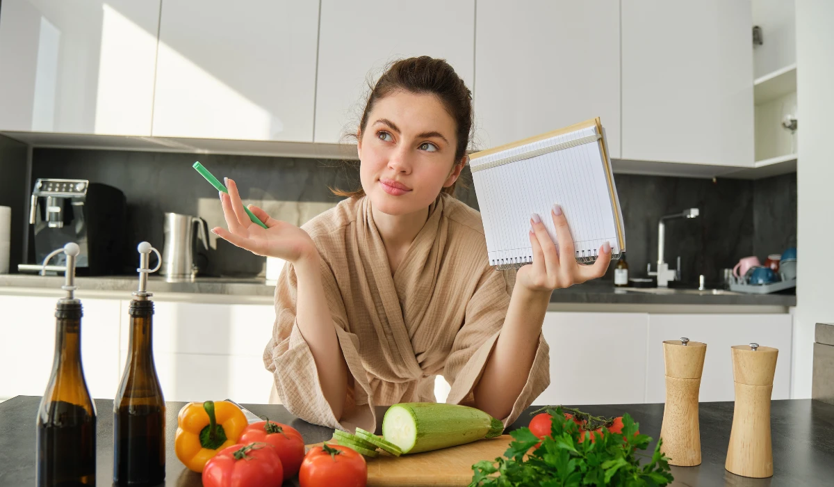 Woman Reviewing Notes at Kitchen Table