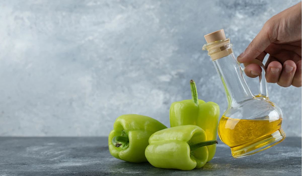 Pouring Oil on Peppers