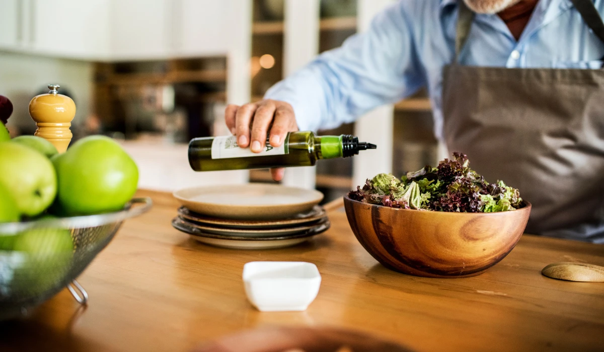 Drizzling Olive Oil on Salad