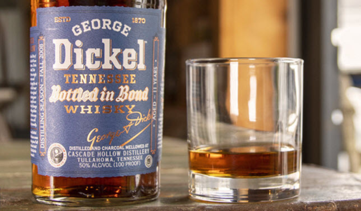 Whiskey Bottle on Wooden Barrel