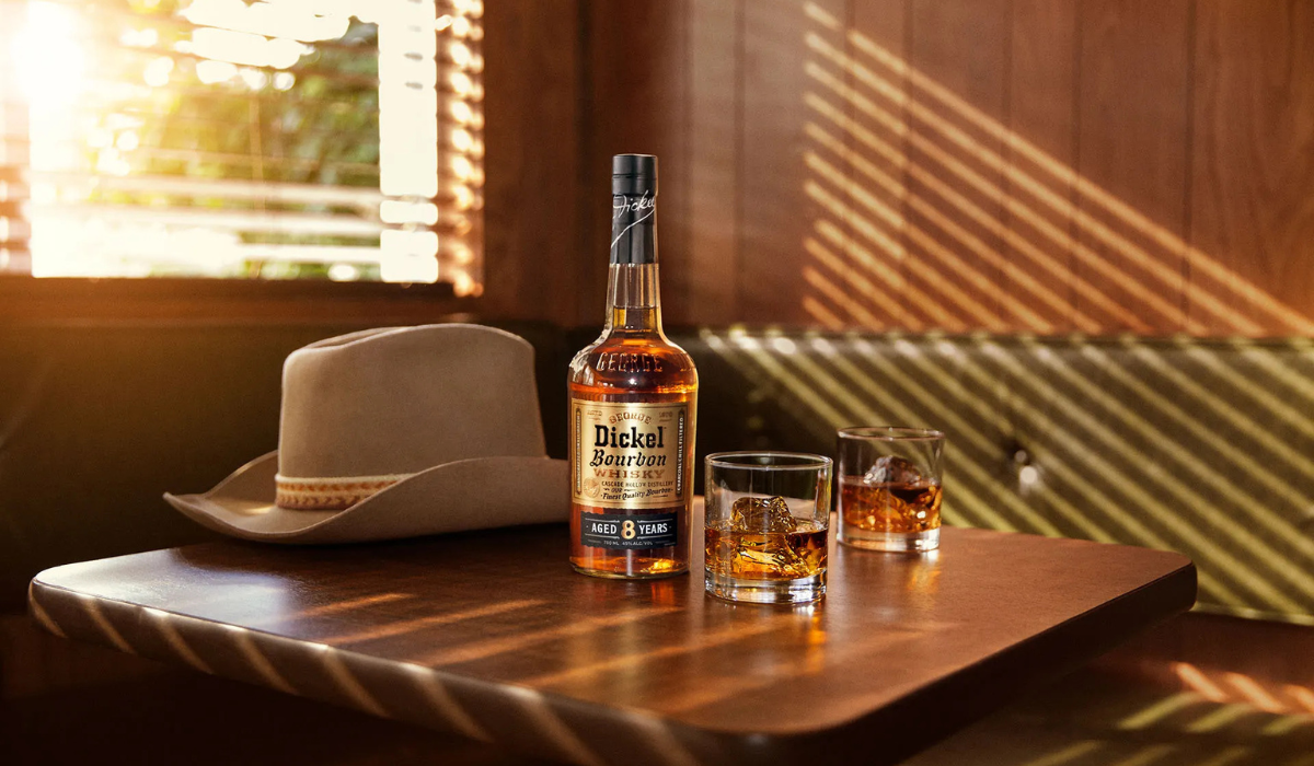 Whiskey Bottle and Hat on Table