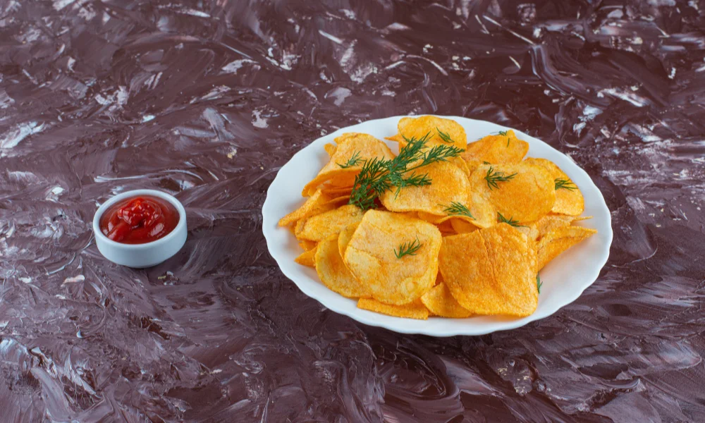 A white plate of crispy potato chips-are kettle cooked chips healthy