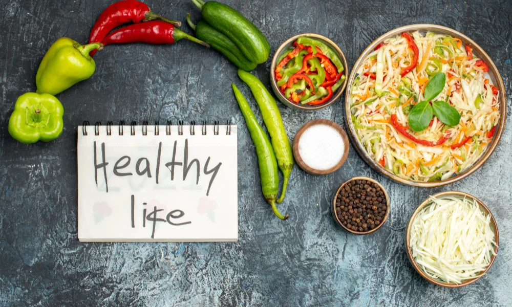 Top view of colorful peppers, cucumbers, and cabbage arranged-healthy cooking quotes