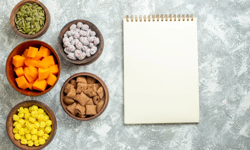 spiral-bound notebook on a textured gray surface-Homemade Dog Food Recipe