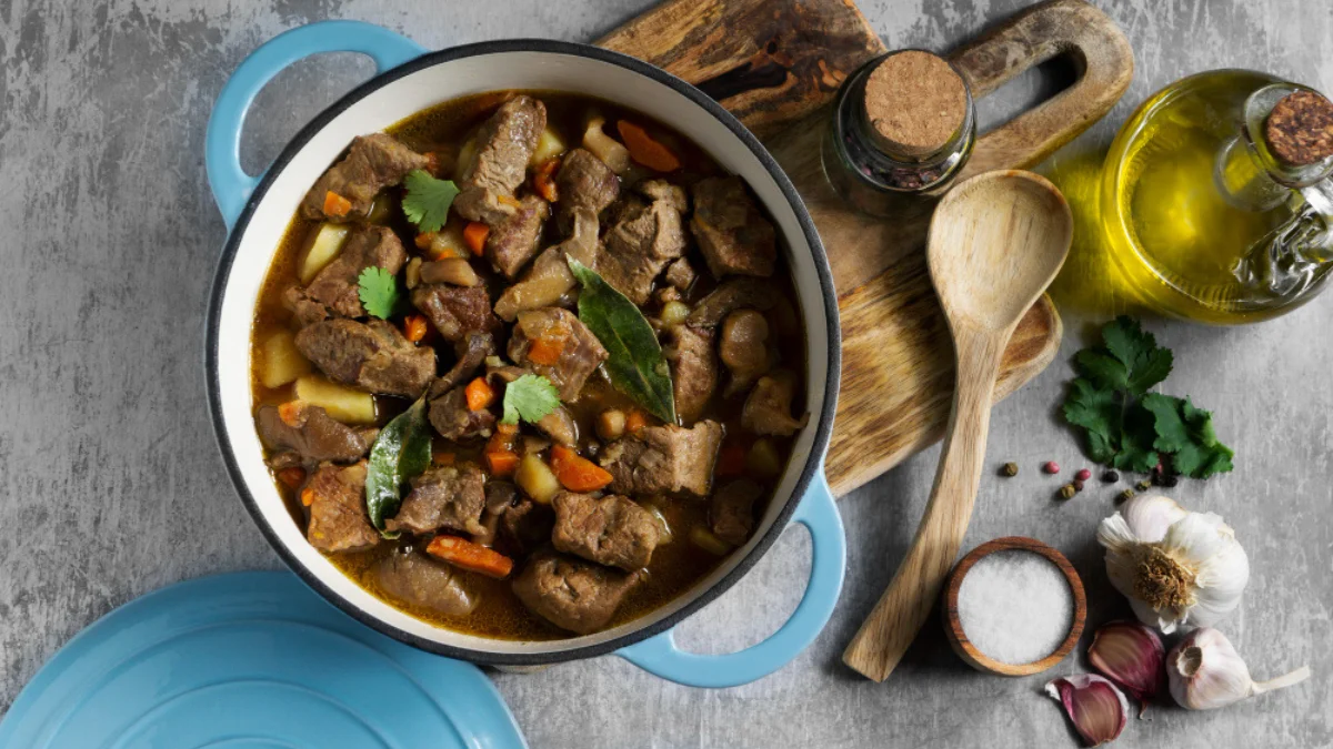 A blue pot filled with stewed beef