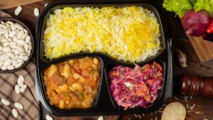 yellow and white rice, bean stew with vegetables