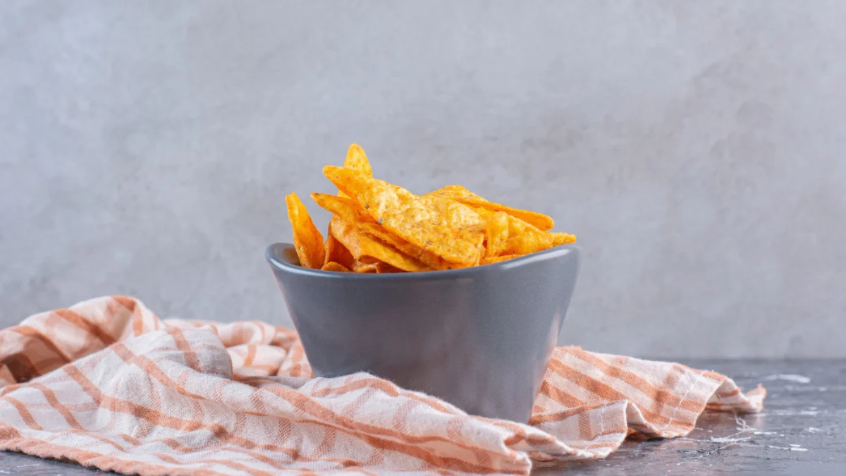 A gray bowl of orange corn chips