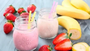 Strawberry and Banana Smoothie Recipe in a creamy pink smoothie glass