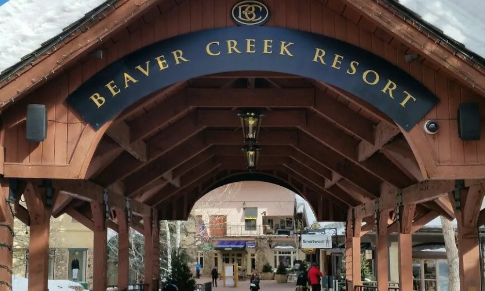 Best Ski Resorts in Colorado highlighted by the covered wooden entrance bridge leading into the village at Beaver Creek Resort.