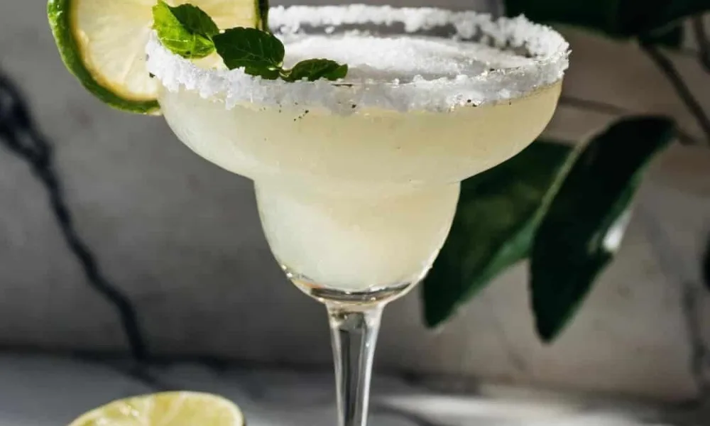 Classic salted margarita in a stem glass for perfect margarita recipes. 