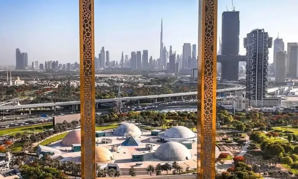 5 must visit places in Dubai features the iconic Dubai Frame offering a panoramic view of the city's modern skyline and Burj Khalifa.