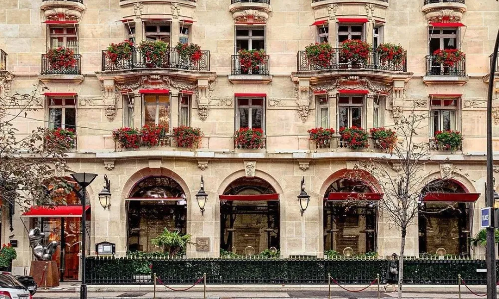 Historic 5-star luxury facade at Hôtel Plaza Athénée for Best Hotels in Paris.