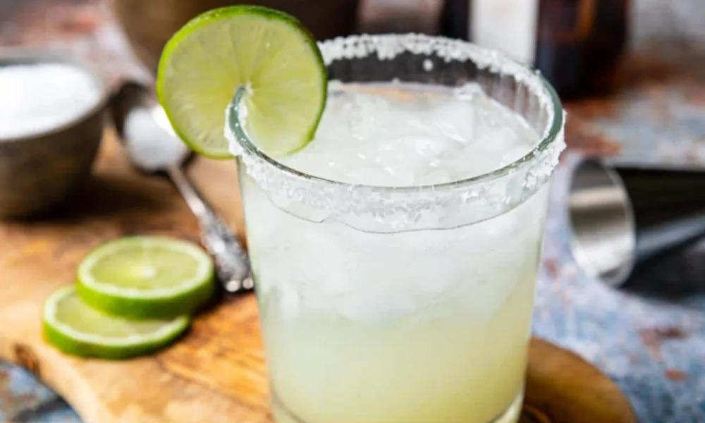 Cold lime margarita on the rocks with a salted rim for perfect margarita recipes. 