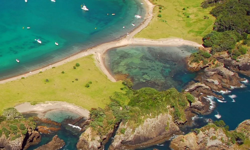 Scenic island coastline and ocean view in the Bay of Islands for Best Places to Visit in New Zealand.