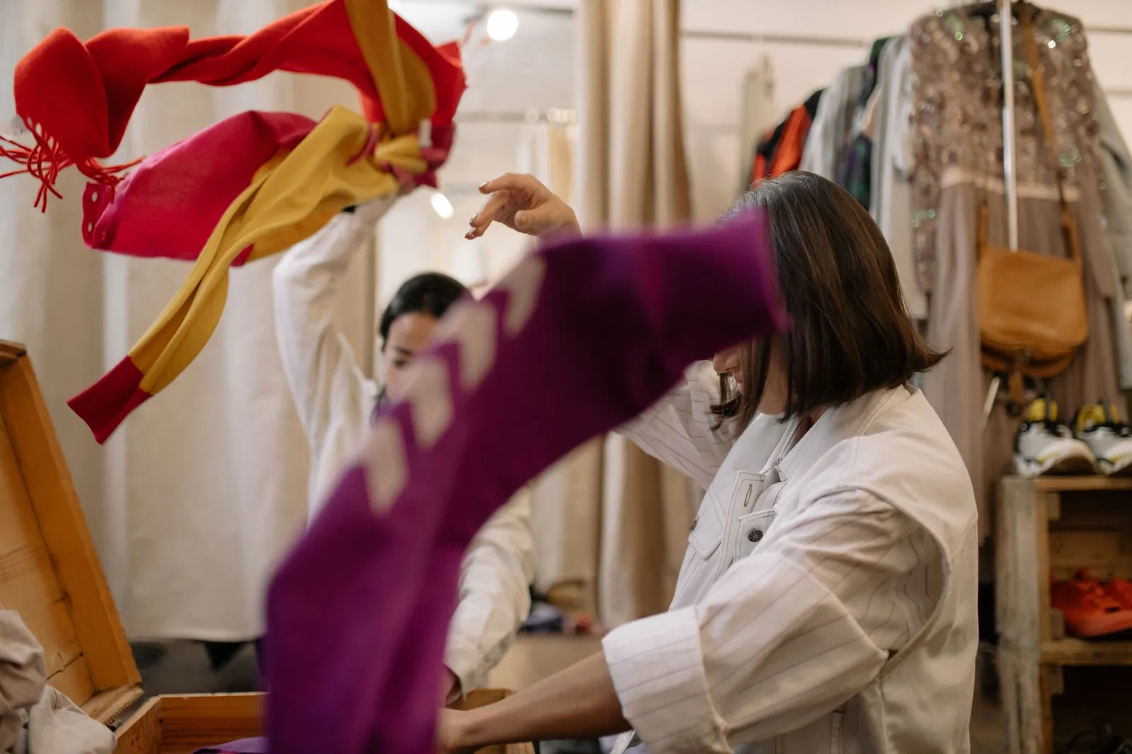 A cotton t-shirt and a wool blazer displayed side by side to represent wardrobe choices.