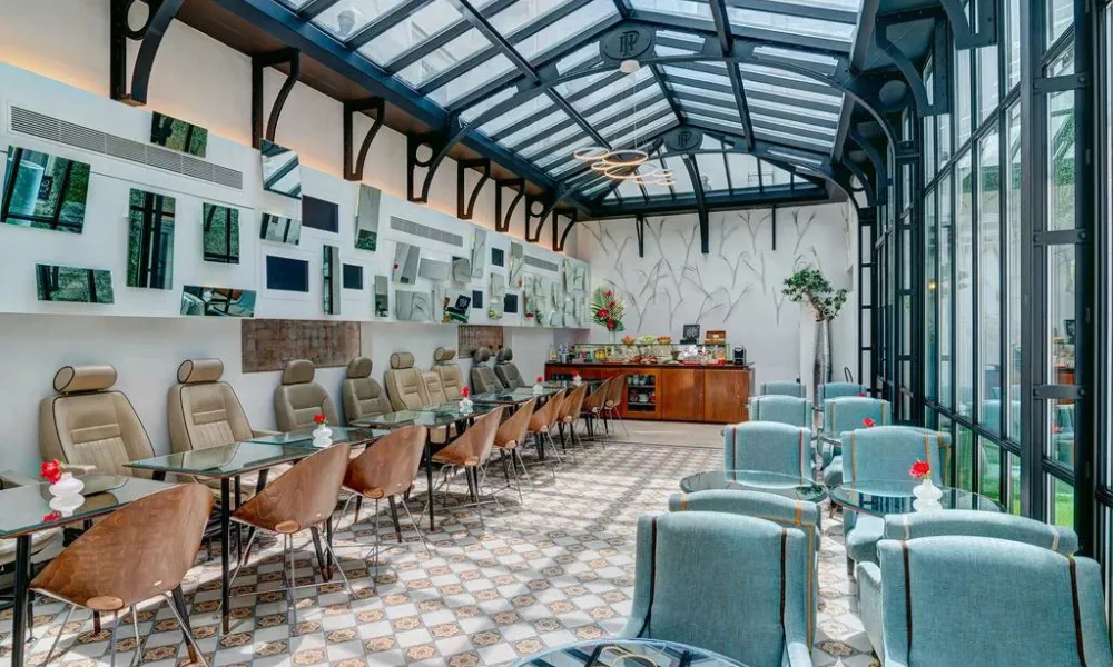 Luxury boutique hotel lounge interior with glass roof for Best Hotels in Paris.