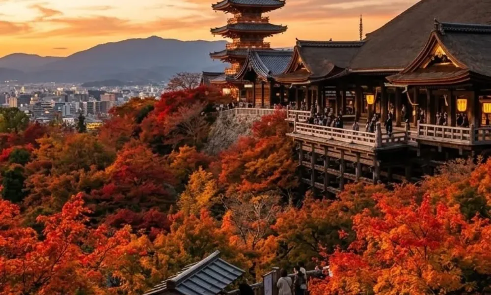 Historic Kiyomizu-dera pagoda in Kyoto surrounded by autumn maple leaves for Best Places to Visit in Spring.