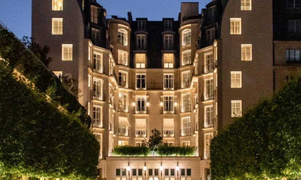 Iconic luxury hotel exterior illuminated at night at Ritz Paris for Best Hotels in Paris.