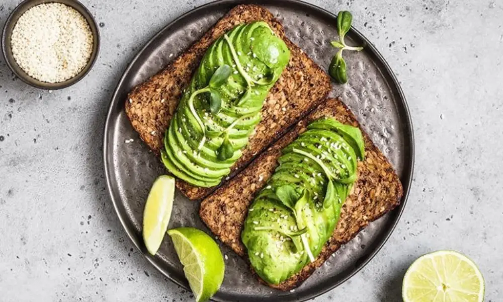 Healthy avocado toast meal for workout energy and recovery in Best Workout Routines for Beginners.
